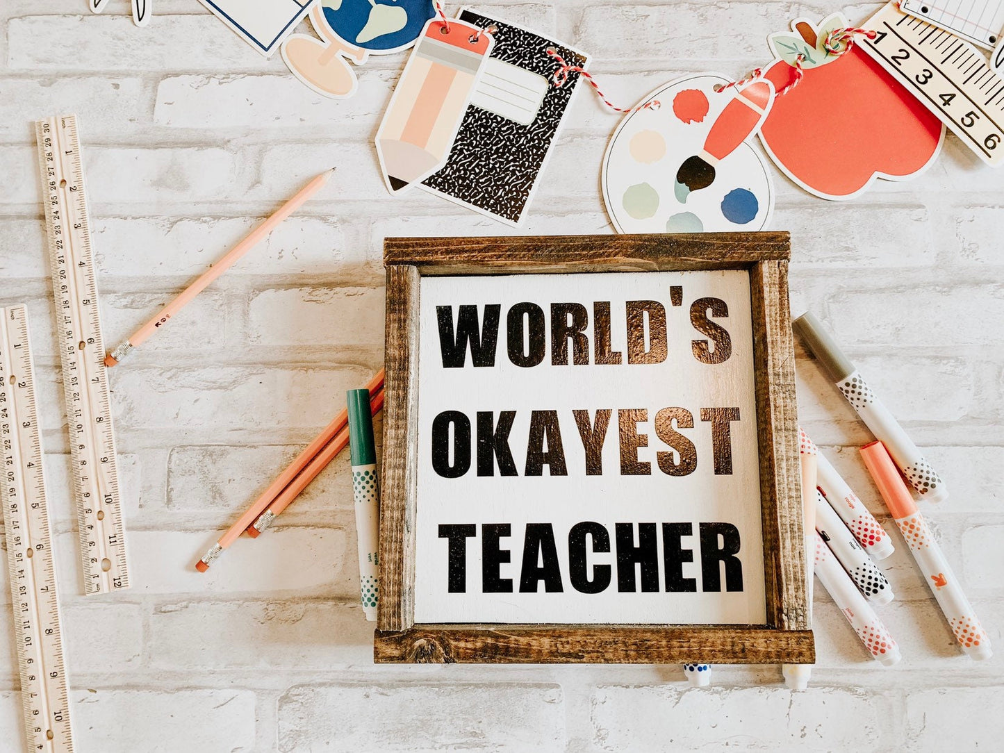 World's Okayest Teacher sign