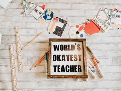 World's Okayest Teacher sign