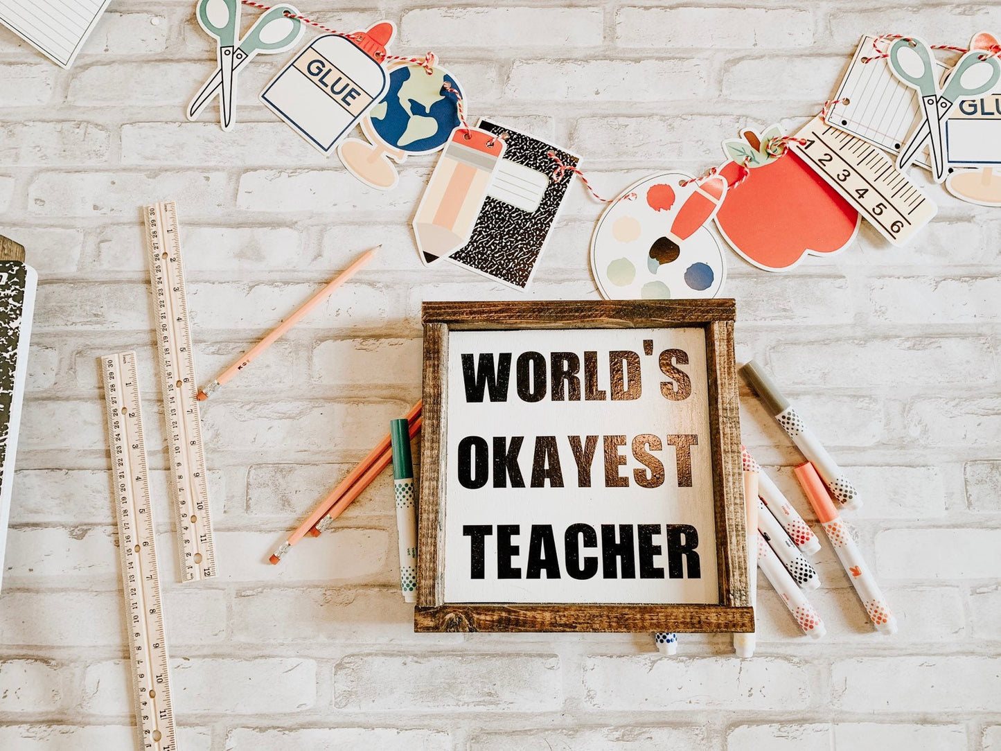 World's Okayest Teacher sign